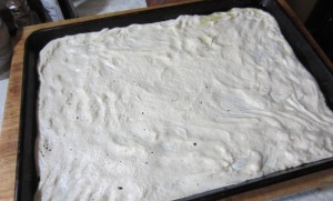 sheet pan pizza pressed in pan
